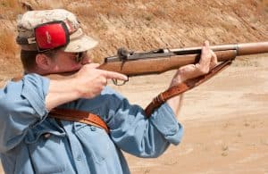 how to hold a rifle steady standing